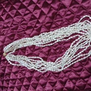 Beaded seashell pearl colored 9 strand necklace